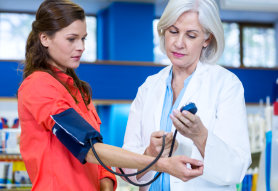 female pharmacist and female customer talking