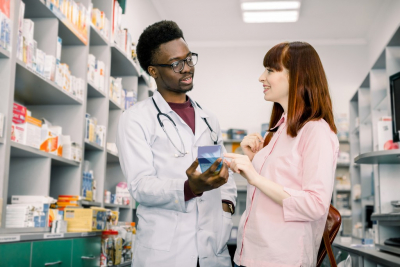 female customer talking to a male pharmacist